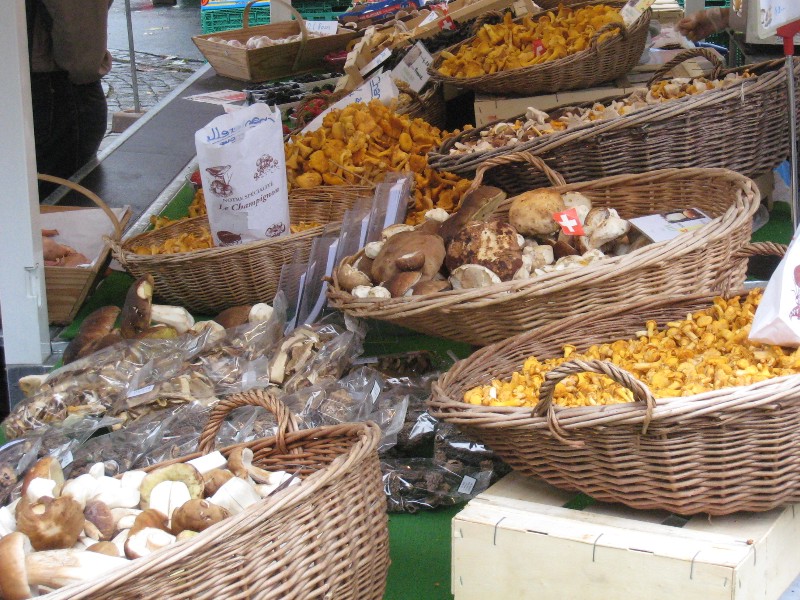 baskets of mushrooms, boletus and chanterelles in the foreground