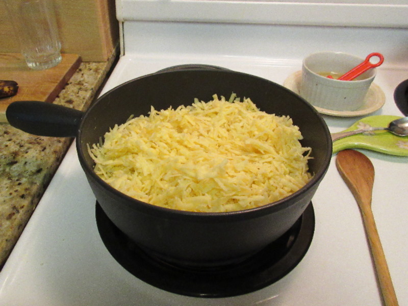 Pot full of grated cheese