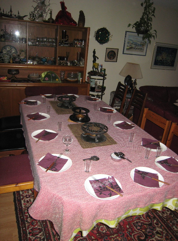 table set with 3 fondue lamps for 13 people
