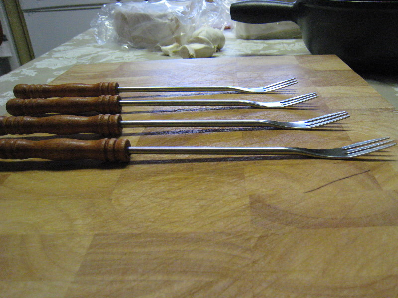 4 different views of modern fondue forks