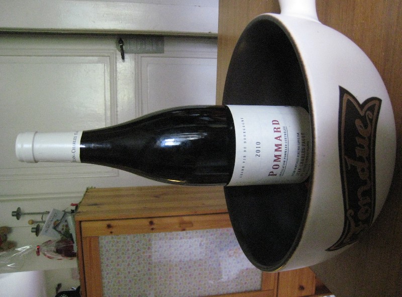 photo of a red wine bottle in a fondue pot